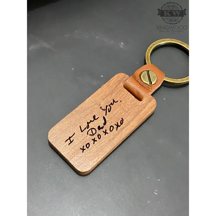 Engraved wooden keychain with custom handwritten design and leather detail for personalized wooden keychains