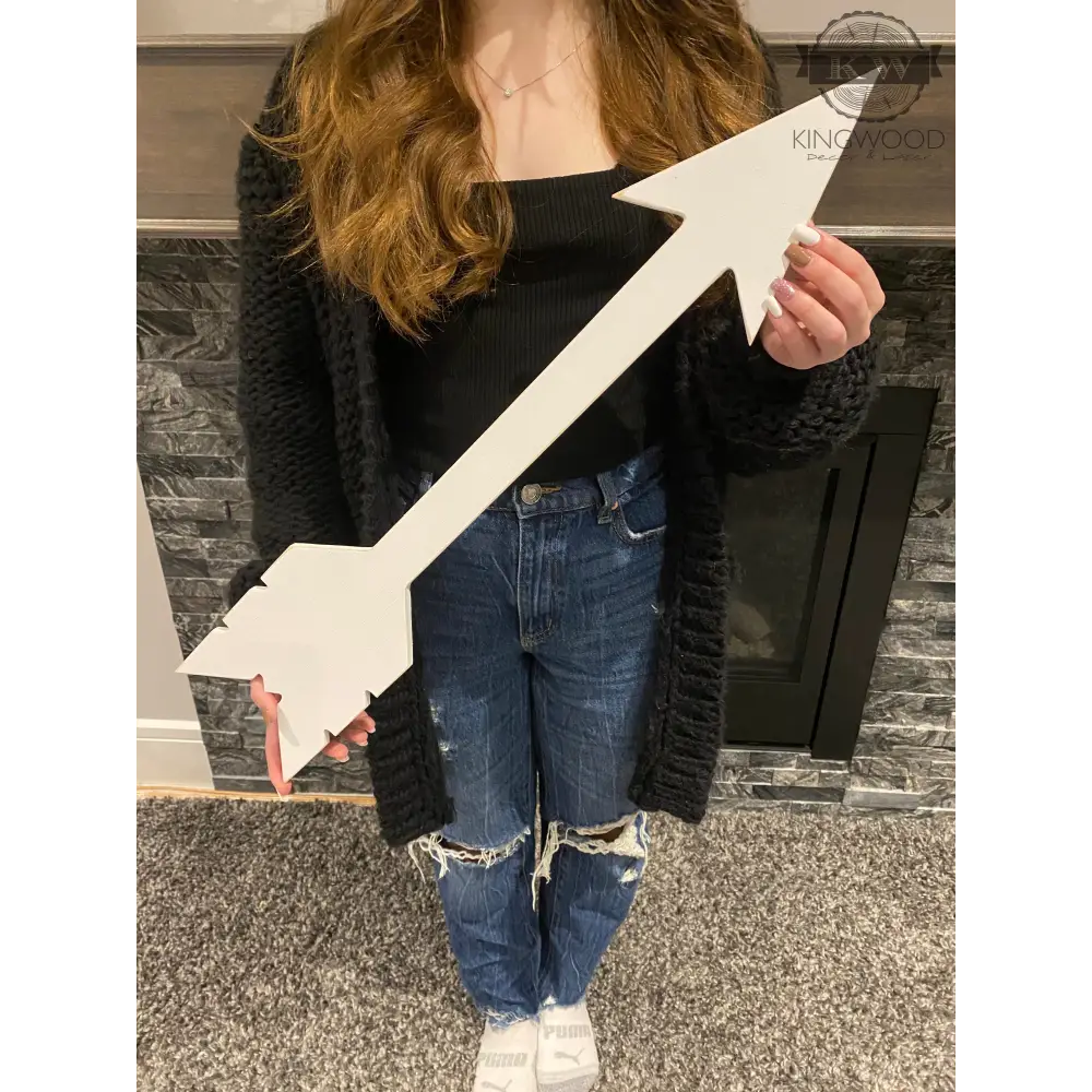 White wooden arrow used as rustic decor in multiple sizes, ideal for home or cutting boards